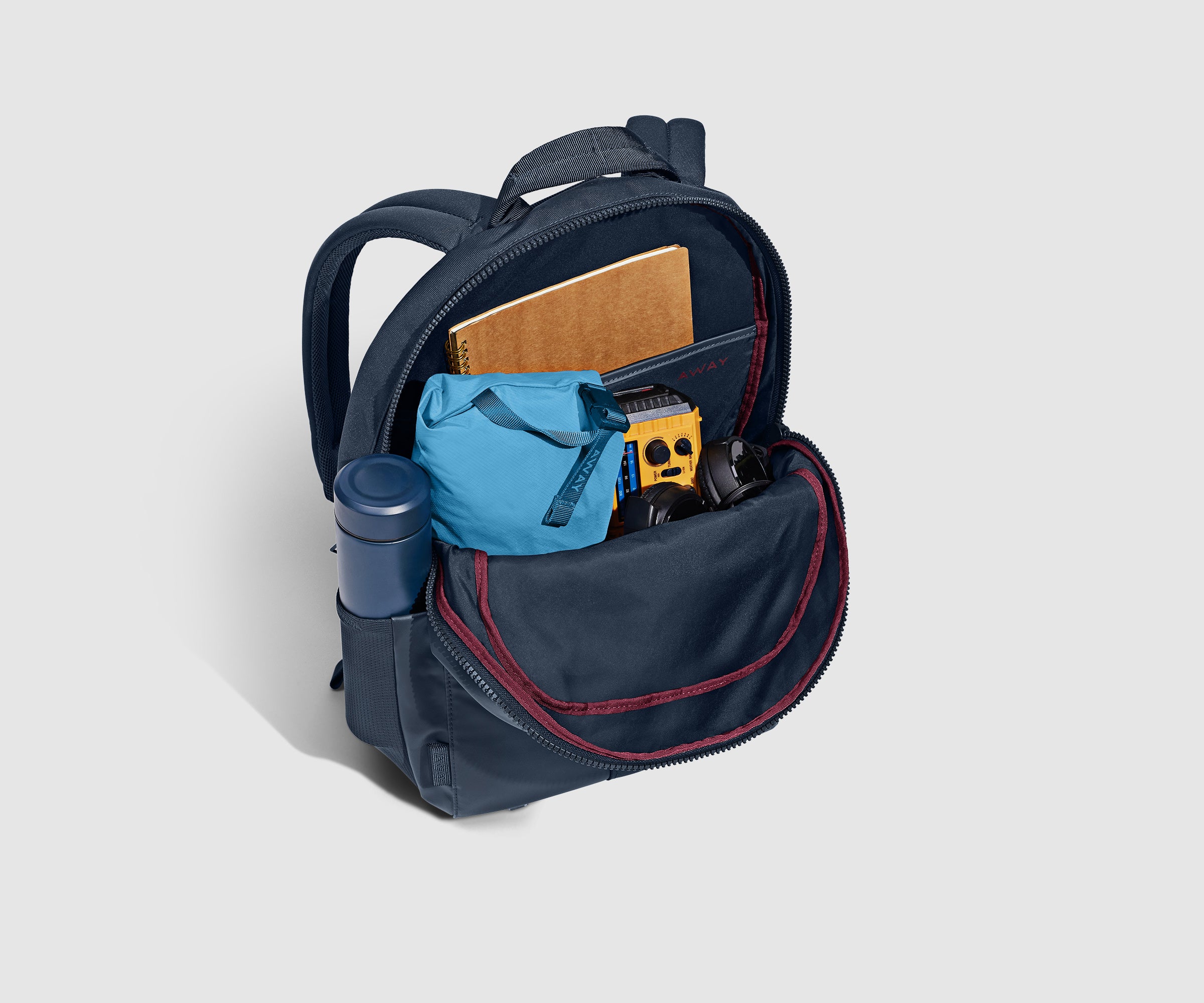 PDP_OutdoorBackpack26L_Navy_BackPocketPacked_6a7adb18-1af3-48c1-94f7-af3fe19a648c.jpg